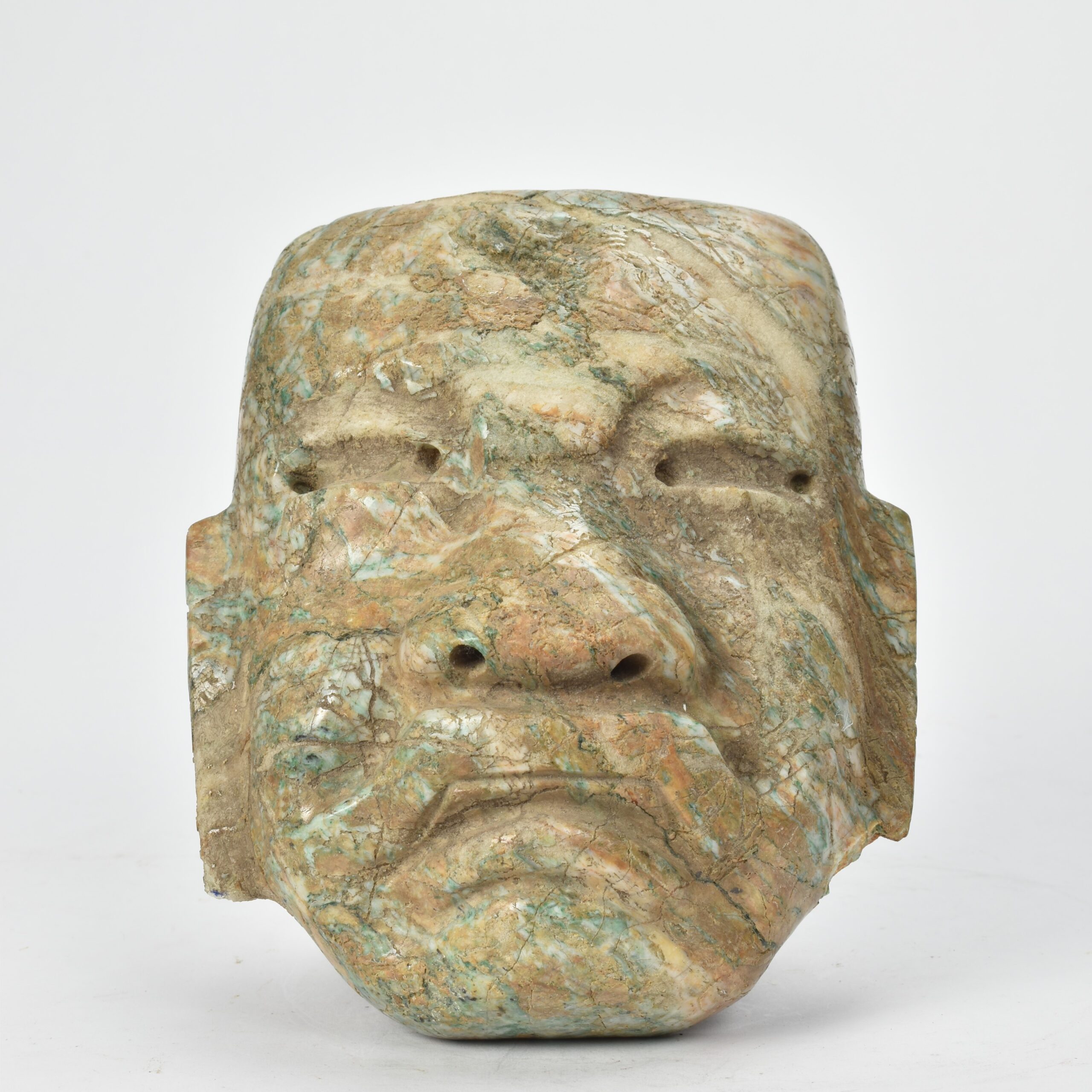 An Olmec-weathered green mask